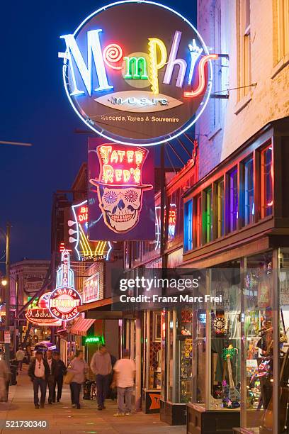 bars and shops on beale street in memphis - memphis tennessee stock pictures, royalty-free photos & images