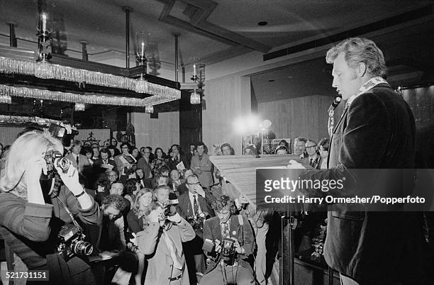 American motorcycle stunt rider Evel Knievel giving a press conference in London, prior to his attempt to jump 13 buses at Wembley Stadium, May 1975....