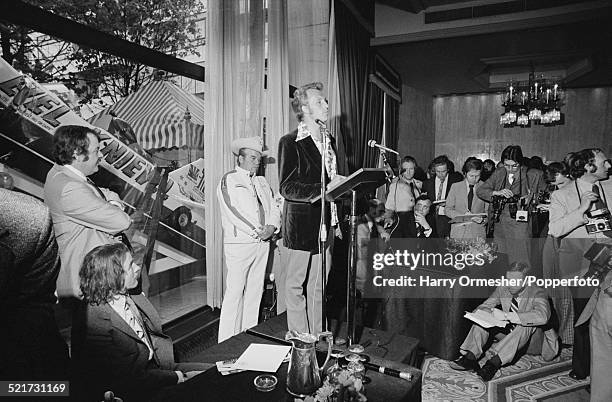 American motorcycle stunt rider Evel Knievel giving a press conference in London, prior to his attempt to jump 13 buses at Wembley Stadium, May 1975....