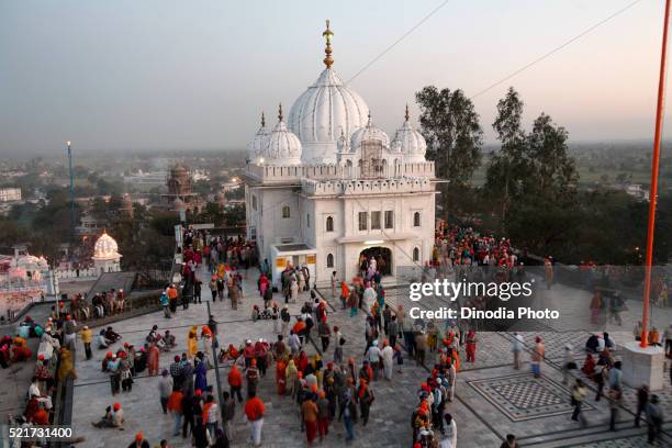 devotees at anandgarh during celebration of hola mohalla at town of anandpur sahib in rupnagar district, punjab, india - punjab india stock pictures, royalty-free photos & images