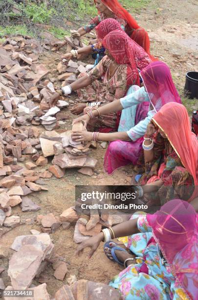 women making house of small stones week long padyatra, jodhpur, rajasthan, india, asia - week 2012 stock pictures, royalty-free photos & images