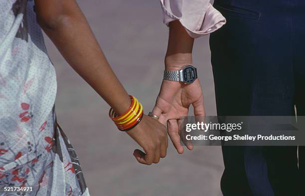 couple holding hands in india - indian couple foto e immagini stock