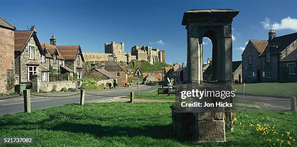 bamburgh castle and village - bamburgh stock pictures, royalty-free photos & images