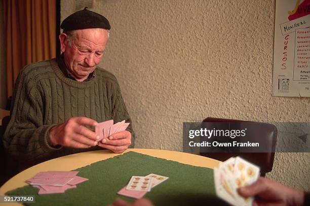 local men play cards in monreal del campo bar - card table stock pictures, royalty-free photos & images