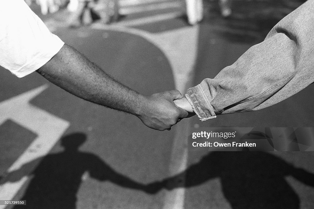 Black and White Demonstrators Hold Hands