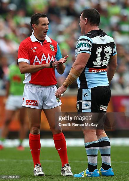 Sharks captain Paul Gallen talks with referee Gerard Sutton during the round seven NRL match between the Canberra Raiders and the Cronulla Sharks at...