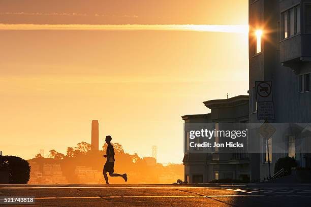 an early morning jogger. - north beach san francisco stock-fotos und bilder