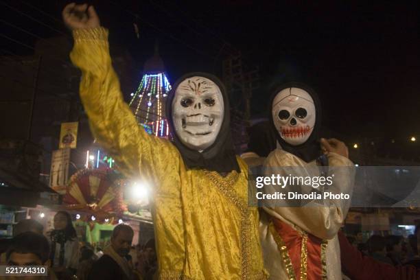 boy wearing metal ghoast mask on shivratri in varanasi at utter pradesh, india - maha shivaratri imagens e fotografias de stock