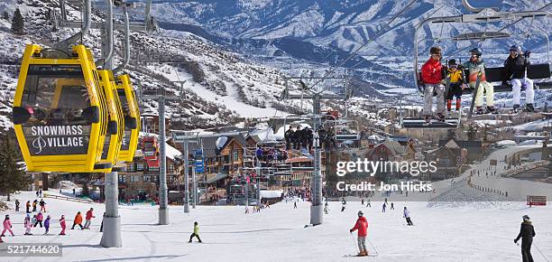 skiers at snowmass village - snowmass stock pictures, royalty-free photos & images