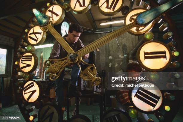 Man Adjusting Clock Photos and Premium High Res Pictures - Getty Images