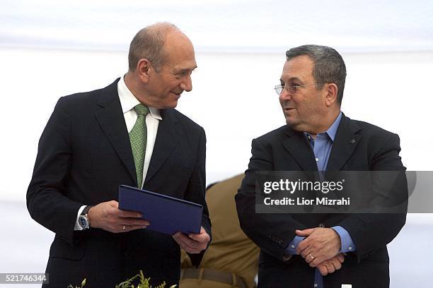 Israeli Prime Minister Ehud Olmert and Defence Minister Ehud Barak are seen during a ceremony on July 31, 2007 in Jerusalem, Israel.