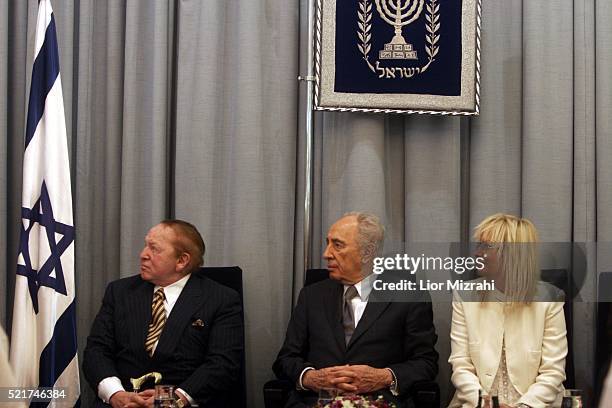 Philanthropist Sheldon Adelson , Israeli President Shimon Peres and Miriam Adelson are seen during a ceremony in The President house on August 12,...