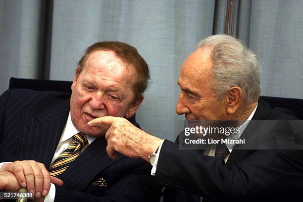 Philanthropist Sheldon Adelson speaks to Israeli President Shimon Peres during a ceremony in The President house on August 12, 2007 in Jerusalem,...