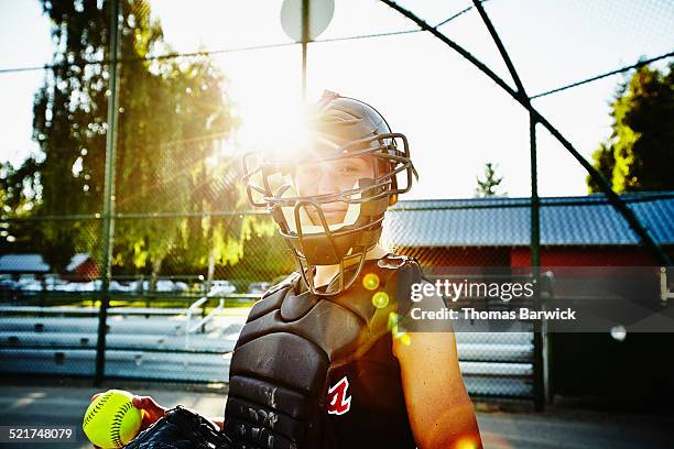 portrait of female softball catcher holding ball - baseball catcher 個照片及圖片檔