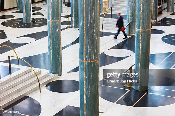 man in main foyer in the new parliament house - parliament house canberra stock pictures, royalty-free photos & images