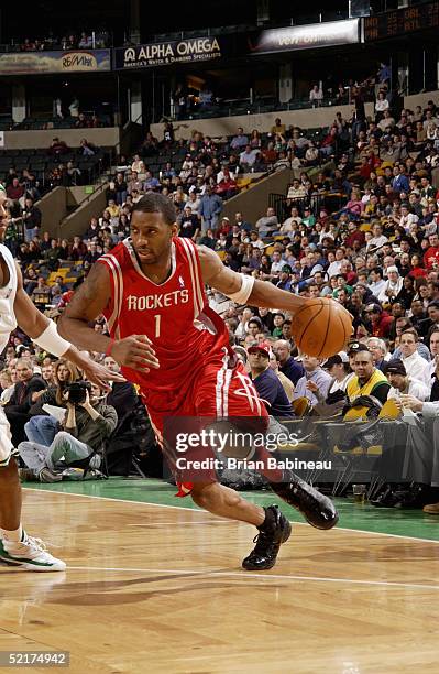 Tracy McGrady of the Houston Rockets drives against the Boston Celtics during the game at the FleetCenter on January 31, 2005 in Boston,...