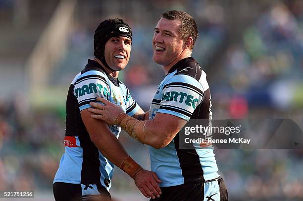 Michael Ennis and Paul Gallen of the Sharks celebrate their teams win during the round seven NRL match between the Canberra Raiders and the Cronulla...