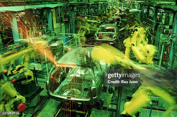 robotics on an automobile assembly line - opel stock pictures, royalty-free photos & images