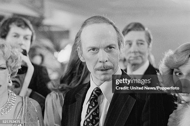 English actor Brian Murphy pictured in character as George Roper on the set of the film version of the television series 'George and Mildred' in...