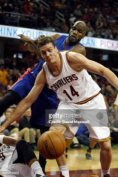Sasha Kaun of the Cleveland Cavaliers chases a rebound in front of Joel Anthony of the Detroit Pistons at Quicken Loans Arena on April 13, 2016 in...