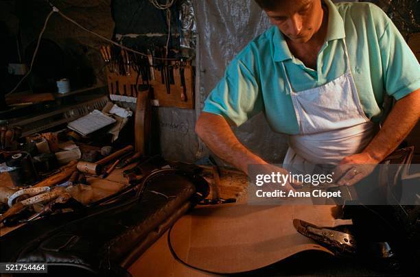 saddle-maker at work - syl bildbanksfoton och bilder