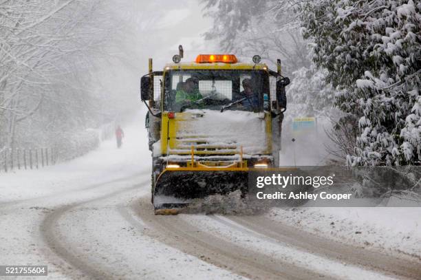 snow plow clearing road - snow plow stock pictures, royalty-free photos & images