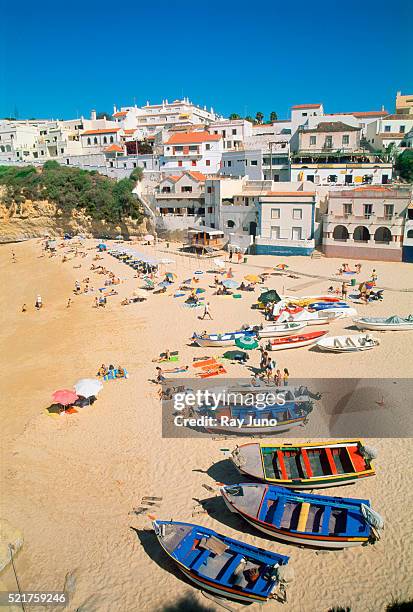 sunbathers at the beach in carvoeiro - carvoeiro fotografías e imágenes de stock