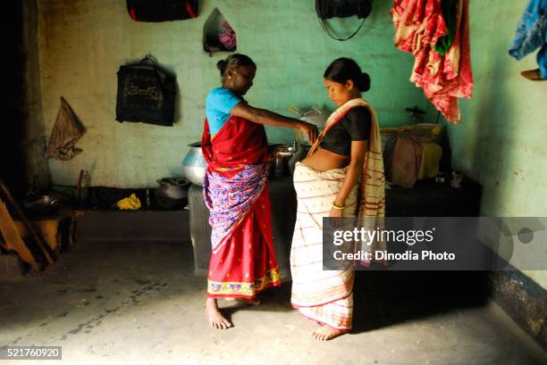 ho tribes midwife examining pregnant woman, chakradharpur, jharkhand, india - indigenous culture stock pictures, royalty-free photos & images