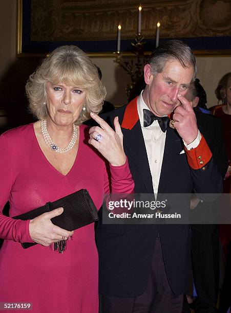 Prince Charles and his fiancee Camilla Parker-Bowles attend a dinner at Windsor Castle on February 10, 2005 in Windsor, England. It is the couples...