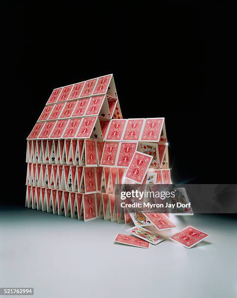 house of cards falling down - castello di carte foto e immagini stock