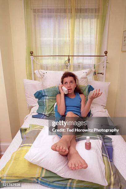 teen letting her nails dry - teen girls toes stock pictures, royalty-free photos & images