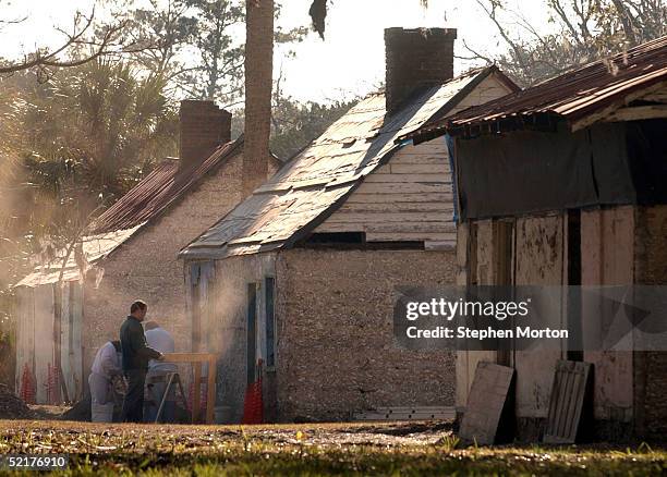 Archaeologists with the Georgia Department of Natural Resources sift through the debris of one of three tabby slave ruins February 10, 2005 on...