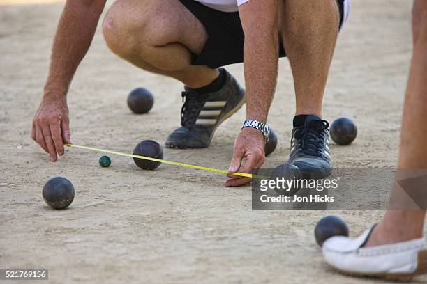 playing petanque - petanque court stock pictures, royalty-free photos & images