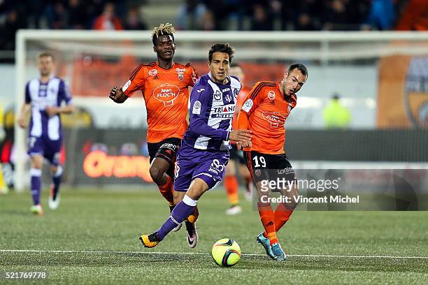 Oscar Trejo of Toulouse and Didier NDong and Romain Philipotteaux of Lorient during the French Ligue 1 between Lorient and Toulouse at Stade du...