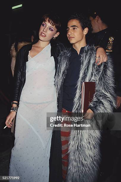 Accompanied by an unidentified woman, fashion designer Zac Posen attends the 50th anniversary party for the Ford Modeling Agency, New York, New York,...