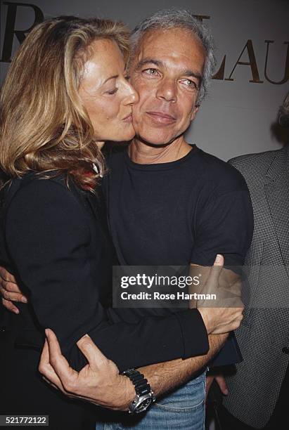 Fashion designer Ralph Lauren and his wife Ricky embrace at a fashion show, New York, New York, 2003.