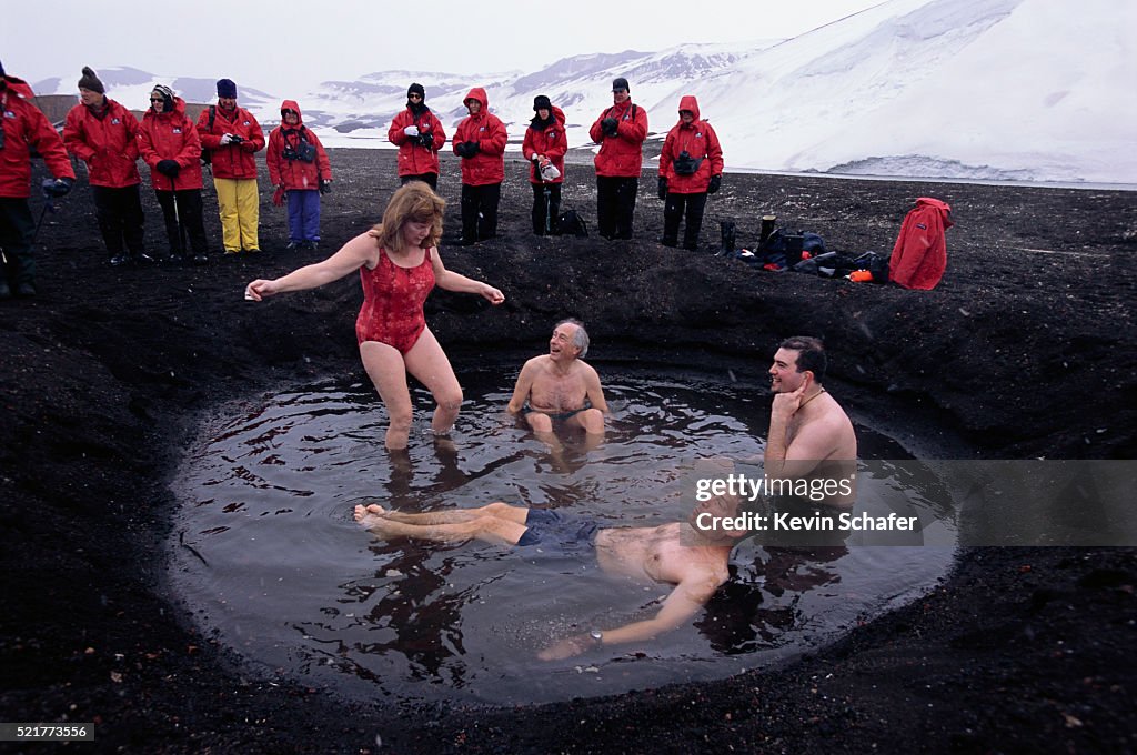 People Relaxing in a Thermal Pool