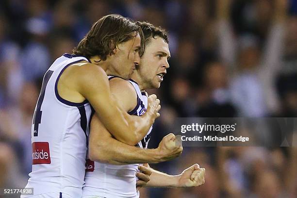 Hayden Ballantyne of the Dockers celebrates a goal with Lachie Weller of the Dockers during the Round 4 AFL match between North Melbourne v Fremantle...