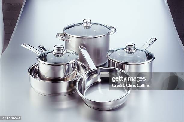 assorted pots and pans - kochgeschirr stock-fotos und bilder