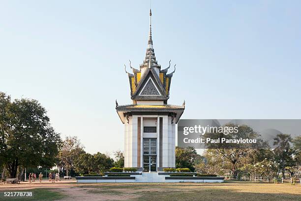memorial stupa at choeung ek for victims of the khmer rouge - cambodia genocide stock pictures, royalty-free photos & images