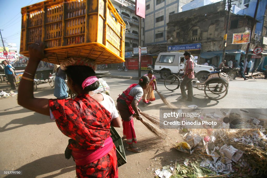 Lady cleaning road in Ranchi city capital of Jharkhand, India
