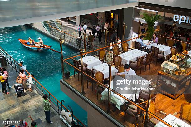 gondola on venetian style canal, the shoppes at marina bay sands, singapore - the shoppes stock pictures, royalty-free photos & images