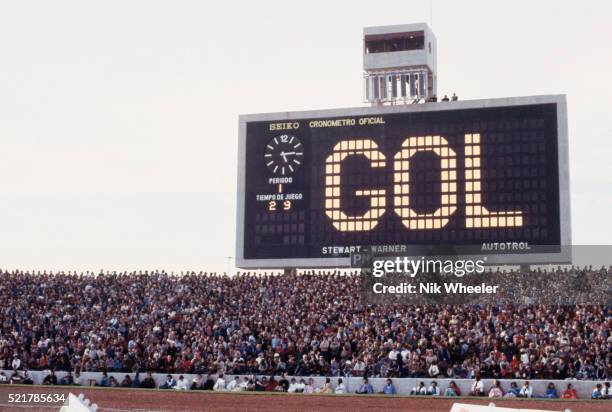 Scoreboard announcing a goal flashes out over a crowded stadium at the 1978 World Cup championship in Argentina.