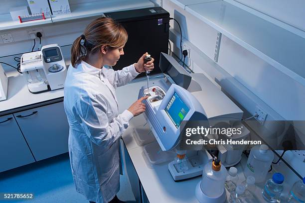 research scientist. - sequencing machines stock pictures, royalty-free photos & images