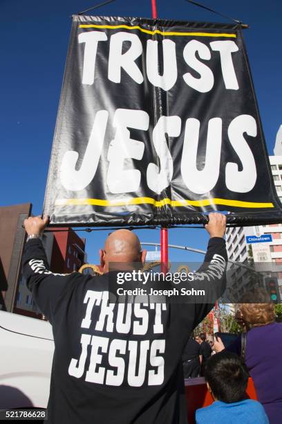 sign reads "trust jesus" sign, chinese new year, los angeles, california, usa, 02.01.2014 - jesus i trust in you stockfoto's en -beelden