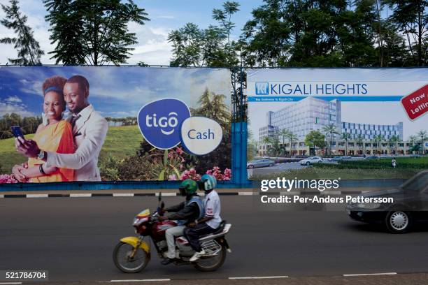 Massive billboards advertising new housing developments and cell phones outside the newly constructed Kigali Convention Complex on November 8, 2014...