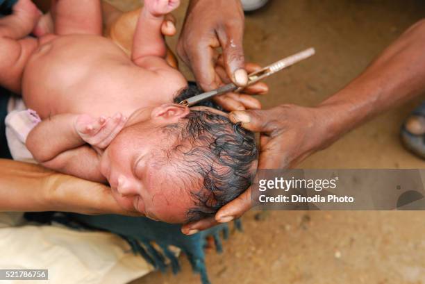 ho tribes baby head shaving off, chakradharpur, jharkhand, india - chakradharpur stock pictures, royalty-free photos & images