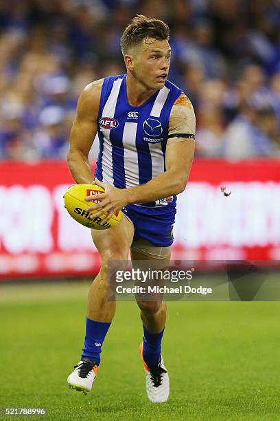 Shaun Higgins of the Kangaroos runs with the ball during the Round 4 AFL match between North Melbourne v Fremantle at Etihad Stadium on April 17,...