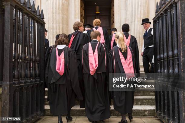 cambridge university graduates enter senate house, england - student senate stock pictures, royalty-free photos & images