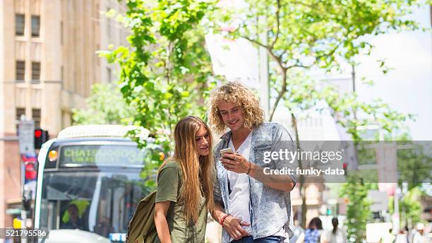 young friends in downtown sydney - sydney bus stock pictures, royalty-free photos & images